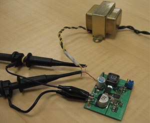 《图三 注入变压器的装置和采用美国国家半导体LM26001的开关式电源电路与探针的连接》